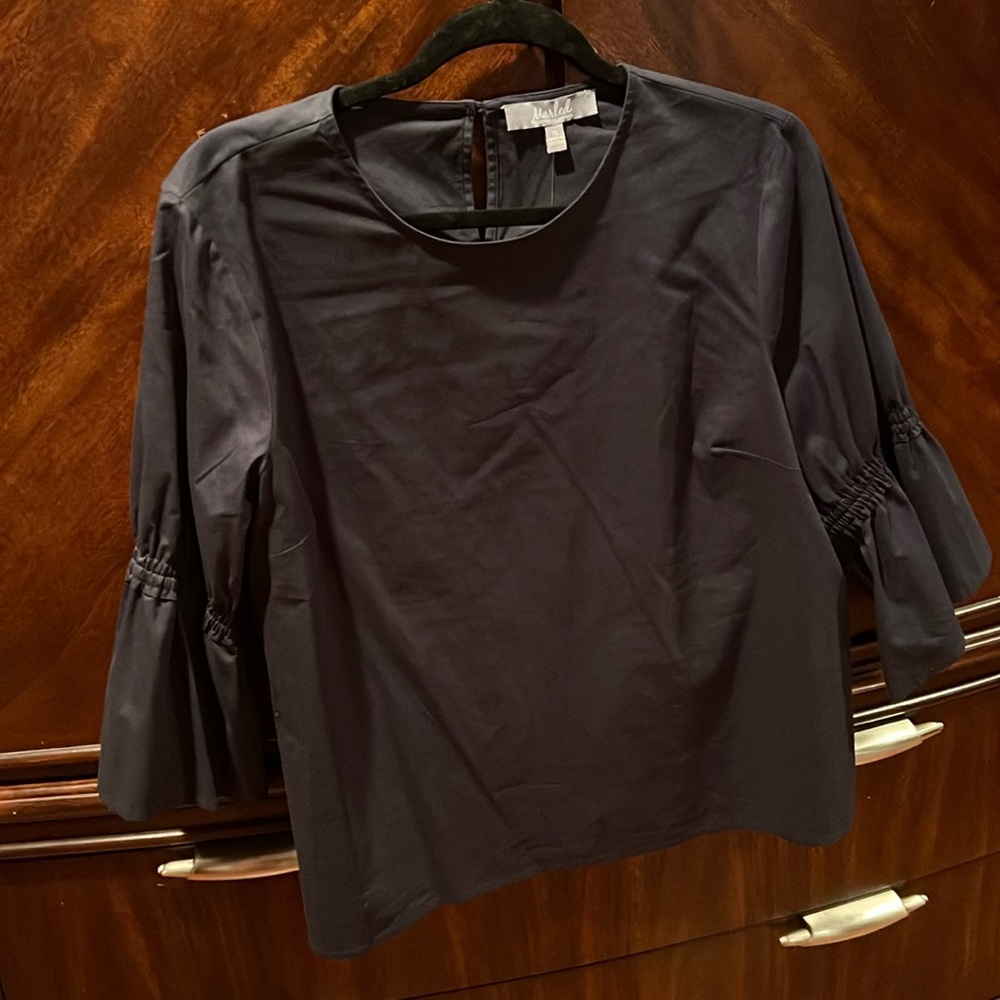 A cropped top with three-quarter sleeves